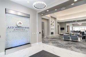 A modern lobby area with stylish furniture and lighting.
