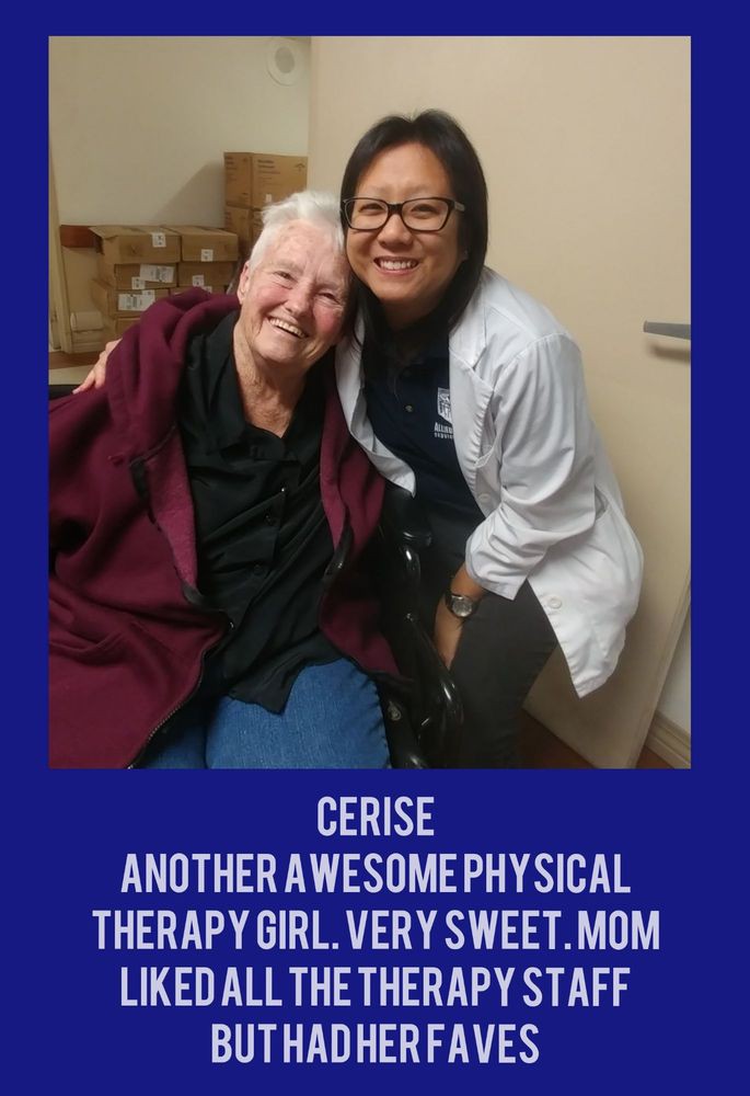 A physical therapist and a patient smiling together, showcasing a positive healthcare interaction.