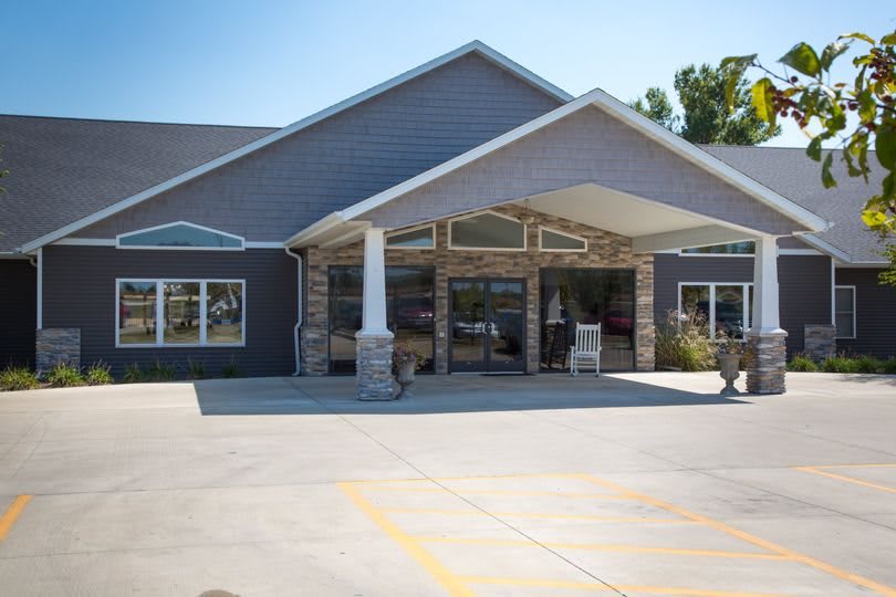 A commercial building with a prominent entrance and an awning.