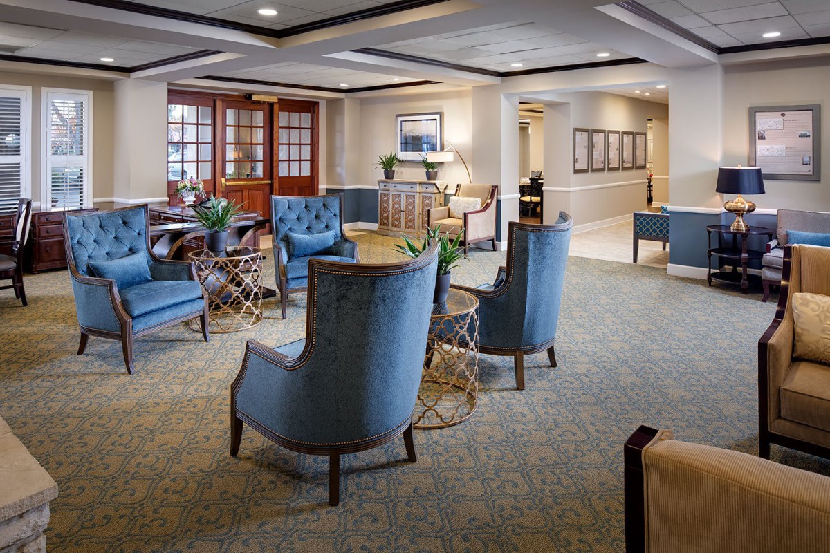 A cozy and elegant lounge area with comfortable seating and tasteful decor.