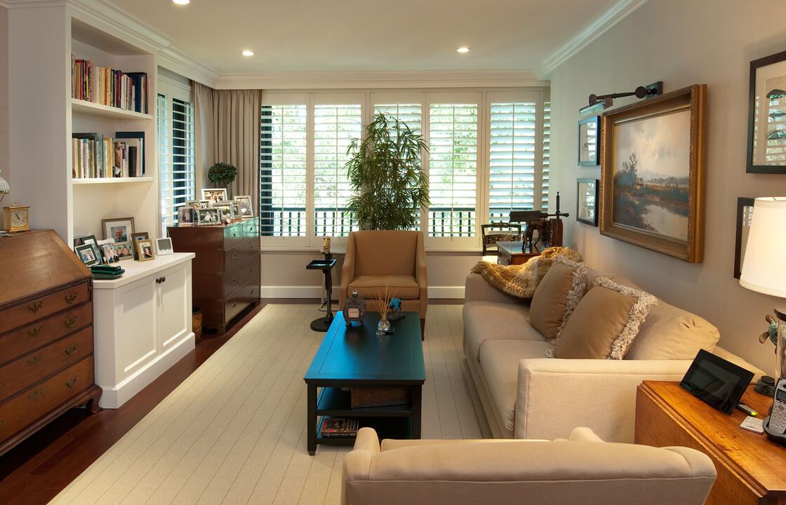 A cozy, well-furnished living room with a sofa and coffee table.