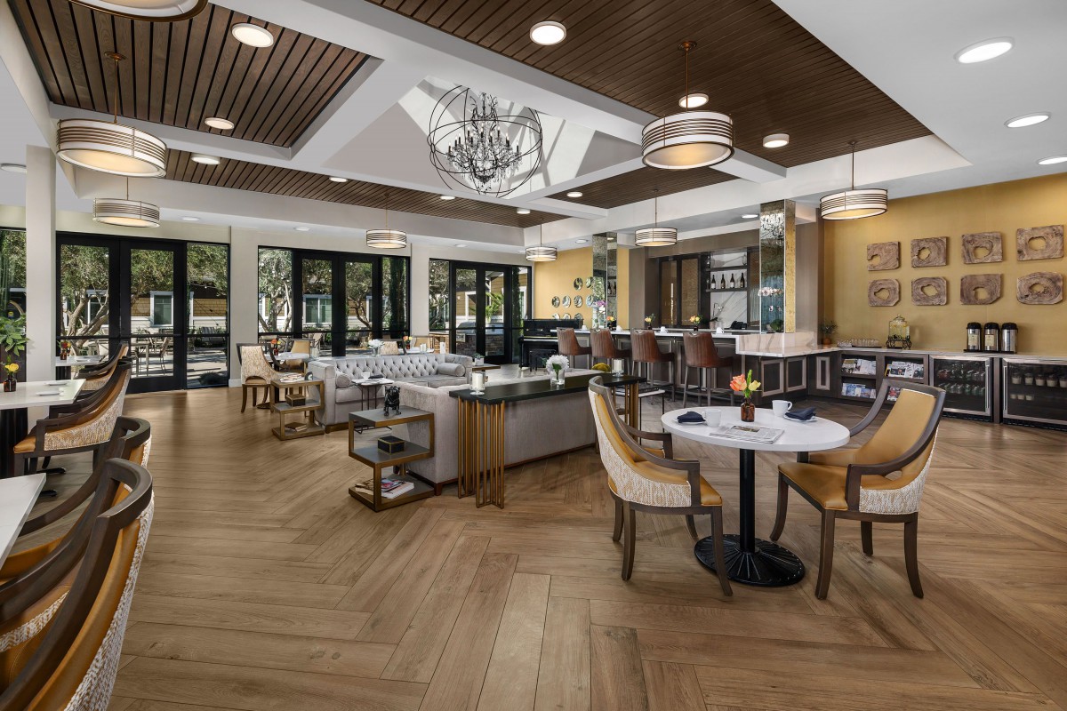 A modern and elegantly designed restaurant interior with chic seating arrangements and ambient lighting.