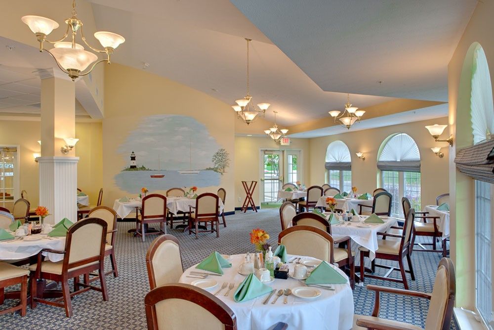 Elegant dining area with neatly arranged tables and ambient lighting.