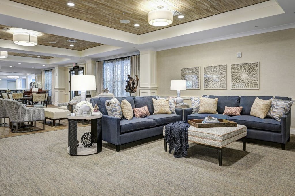 A modern living room featuring comfortable sofas, elegant lighting, and tasteful decor.