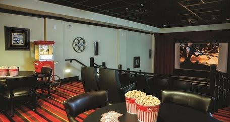 A cozy home theater setup with popcorn ready for movie night.