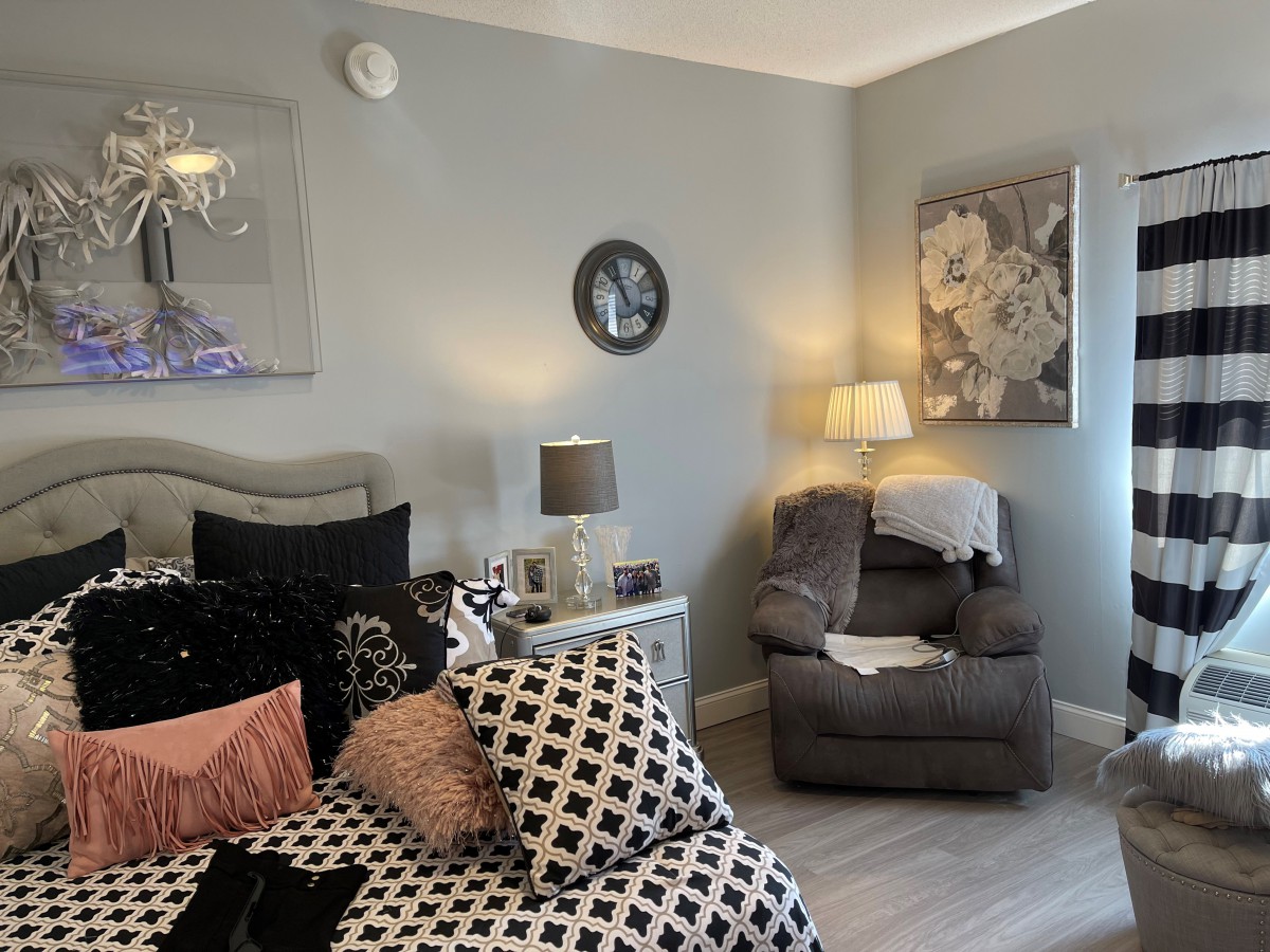 Cozy bedroom with stylish decor and comfortable seating.