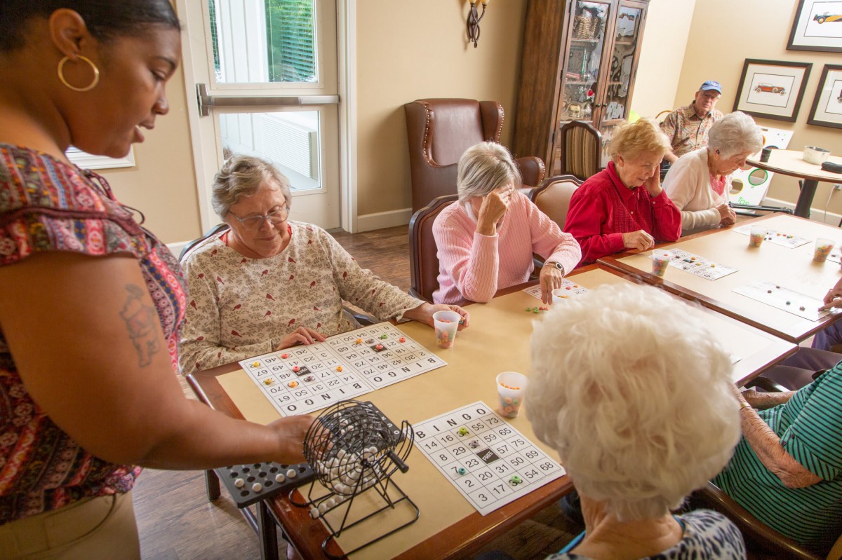 A group of senior citizens playing bingo at a community center.