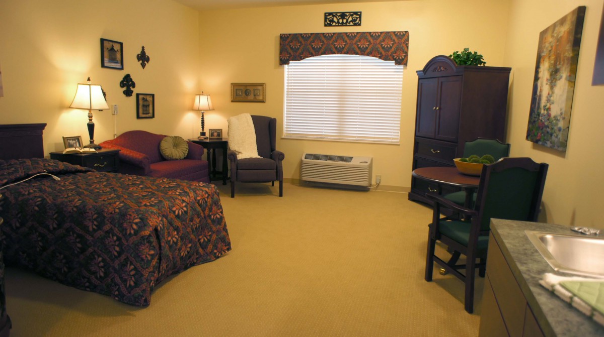 A cozy living space with warm lighting, comfortable seating, and elegant decor.