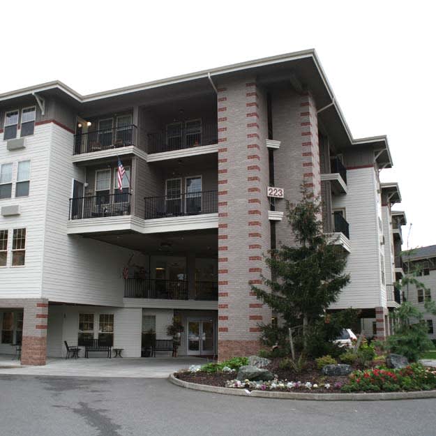 A modern residential apartment building with a well-maintained exterior.