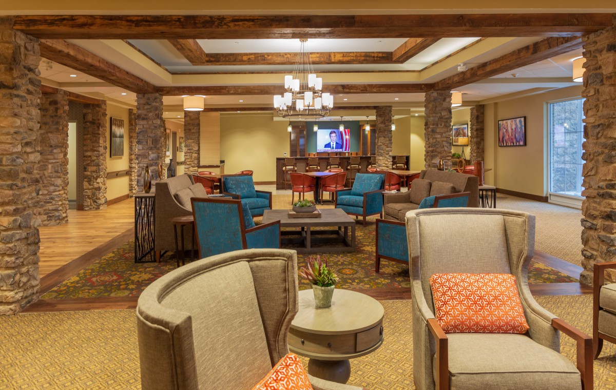 A cozy hotel lobby with modern furniture and a welcoming seating area.