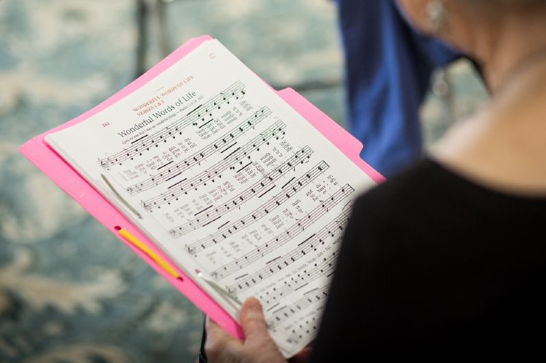 A close-up view of sheet music on a stand, ready for a musical performance.