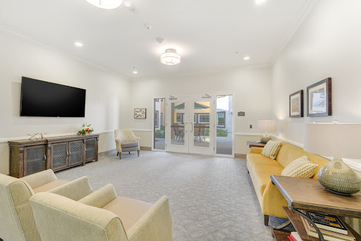 A modern and inviting living room space featuring comfortable seating and bright, airy design.