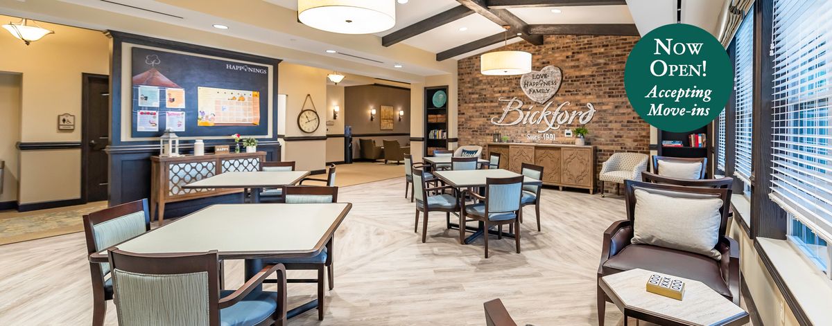 A well-lit dining area with modern furniture and elegant decor.