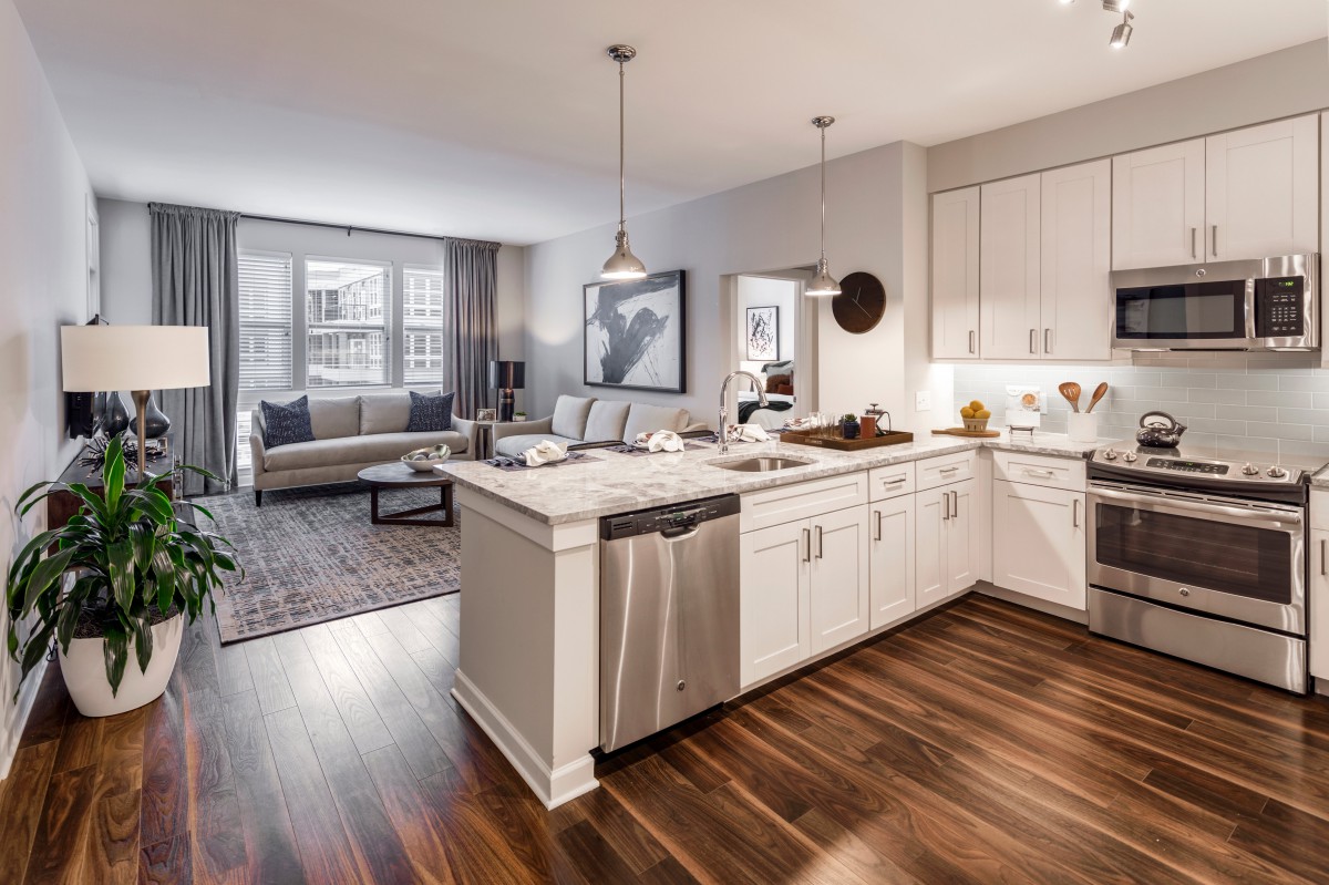 Modern open-concept kitchen and living room with elegant interior design.