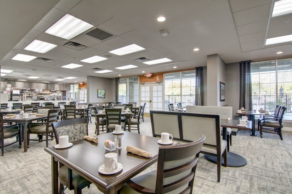 Modern restaurant dining area with neatly arranged tables and chairs.