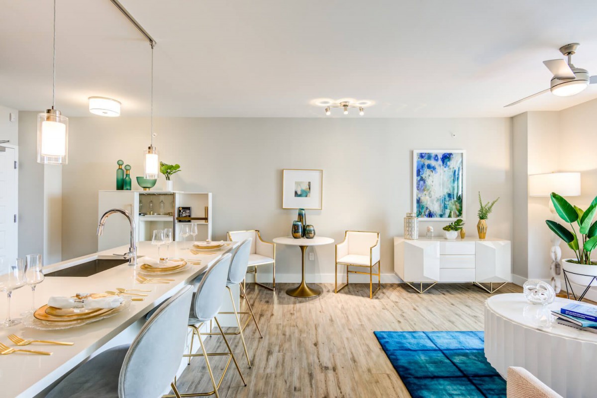 A modern living and dining area with stylish furniture and decor.