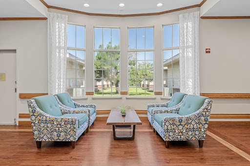 A cozy living room with stylish seating and abundant natural light.