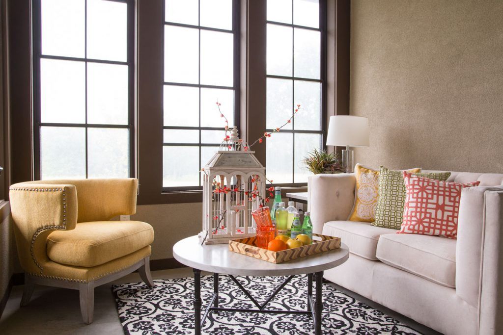 A cozy living room with modern furniture and elegant decor.