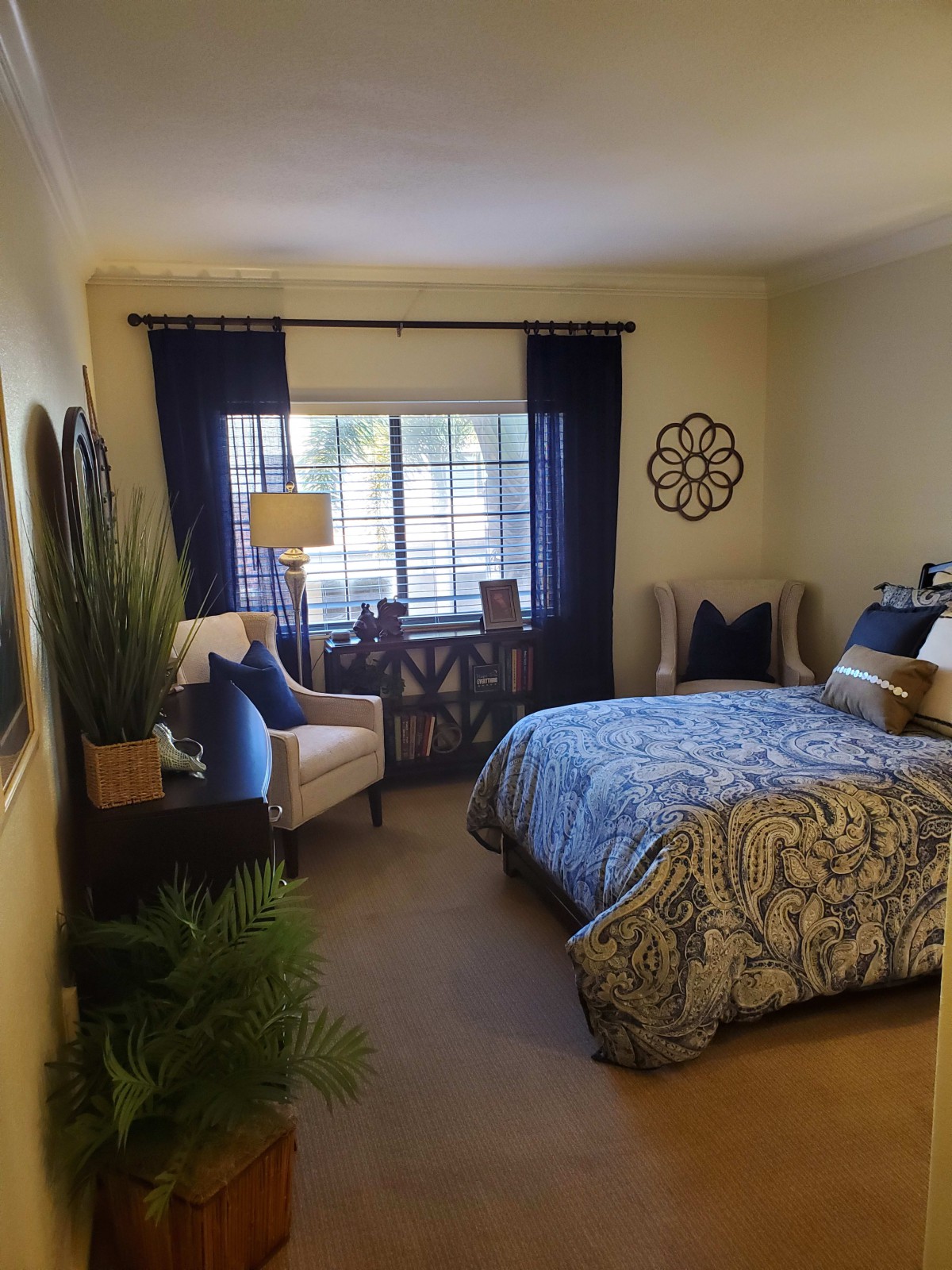 Cozy bedroom with stylish decor and natural light.