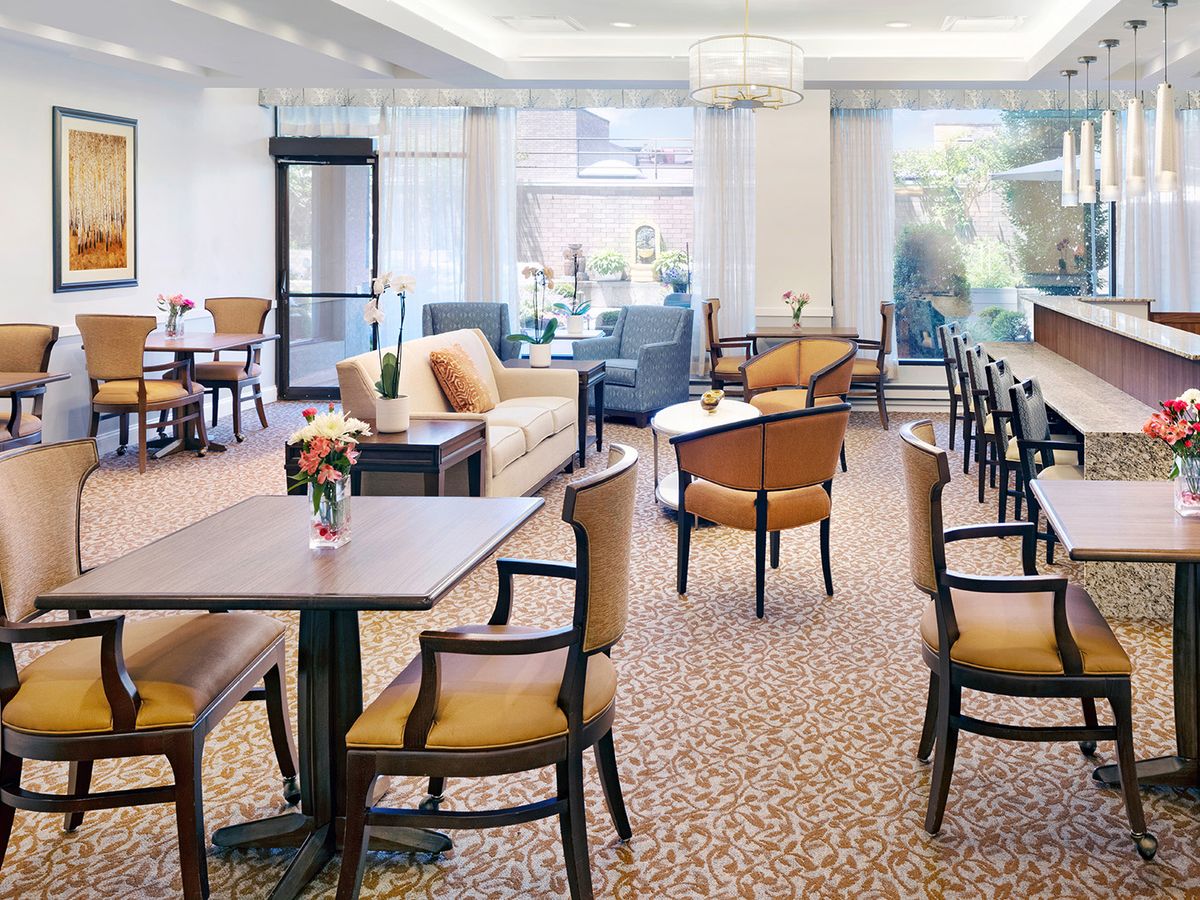 A cozy lounge area with tables and chairs arranged for comfort.