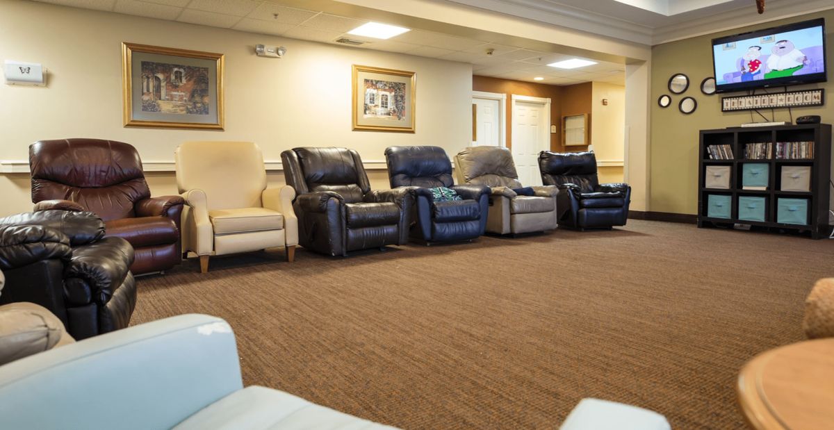 A row of comfortable recliners arranged in a living room setting.