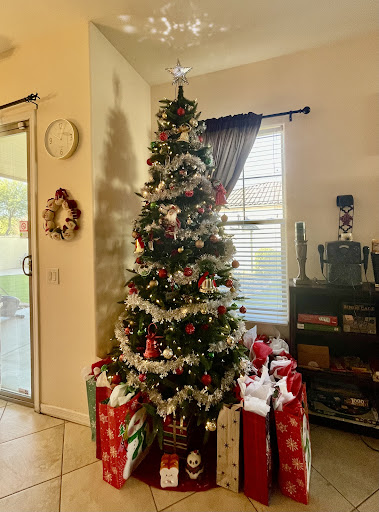 A beautifully decorated Christmas tree surrounded by wrapped gifts, bringing festive cheer to the home.
