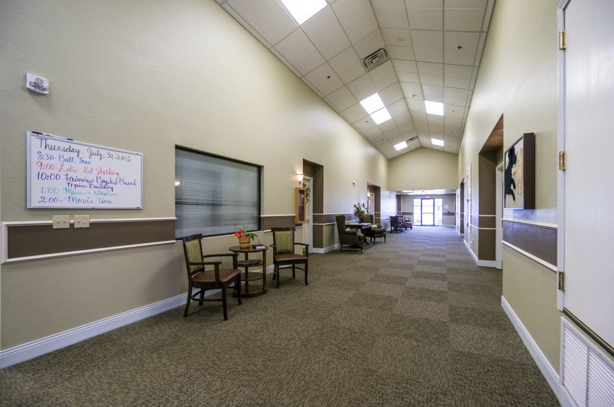 A spacious office hallway with seating arrangements.
