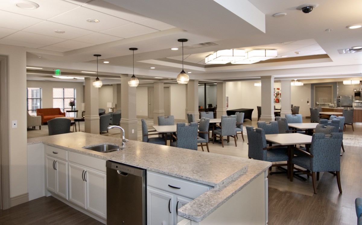 Modern dining area with elegant seating and lighting.