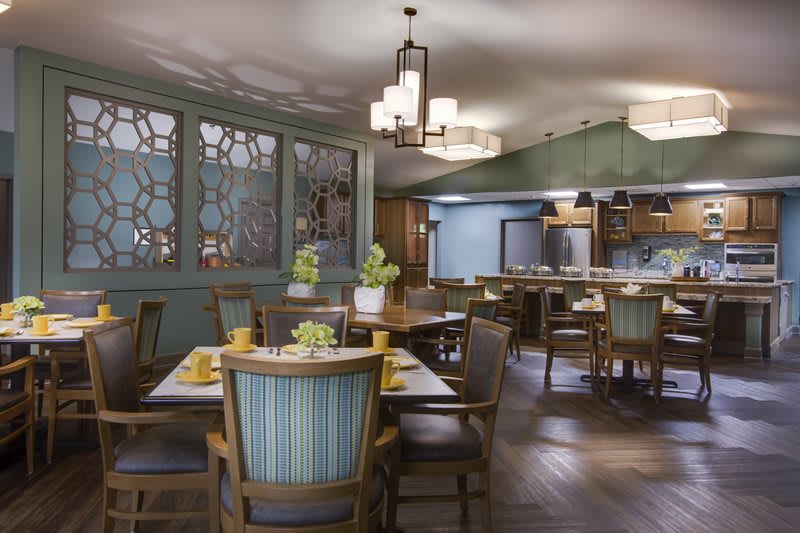 A cozy restaurant interior with elegant decor and comfortable seating.