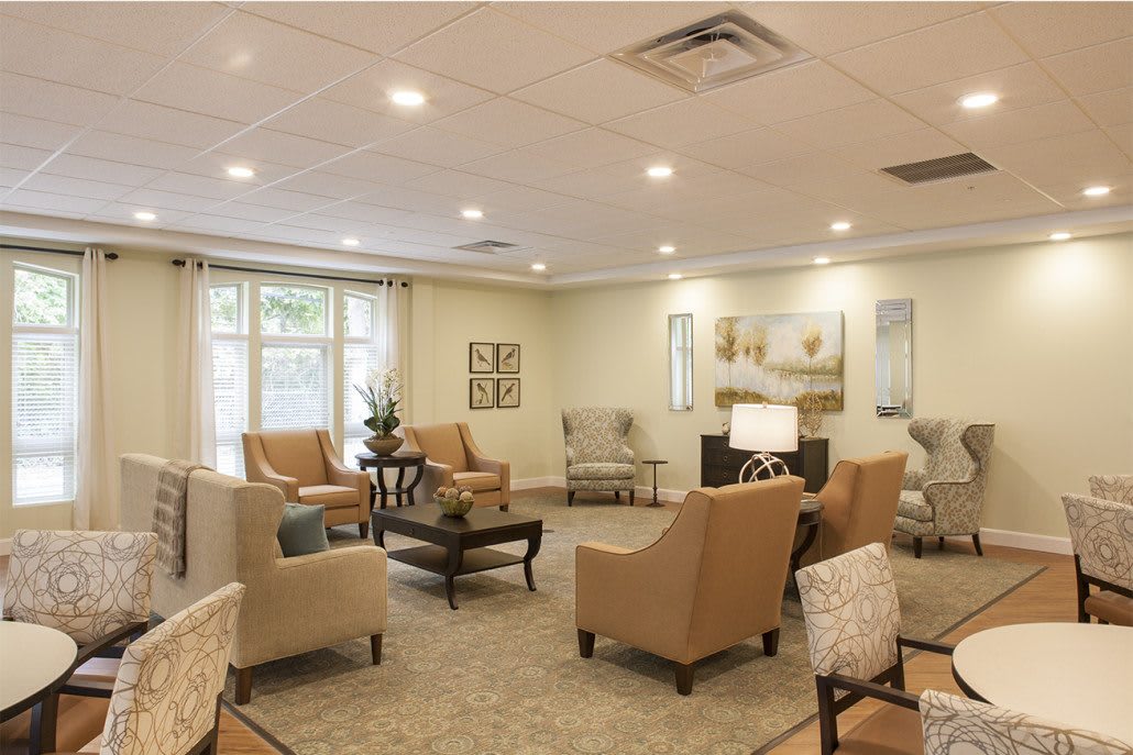 A cozy living room with comfortable seating and warm lighting.