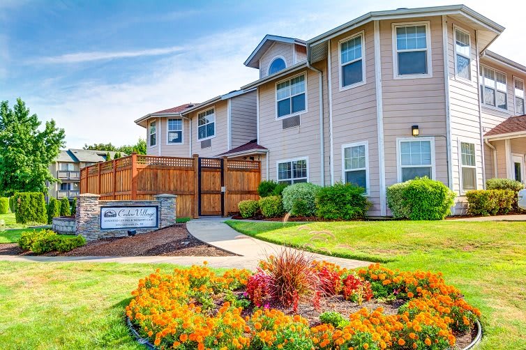 A well-maintained apartment building with vibrant landscaping.