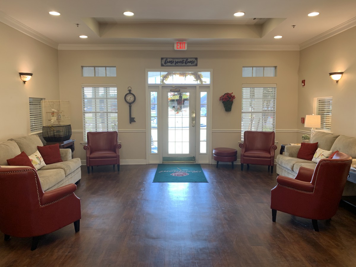 A well-lit and cozy lobby area with comfortable seating and decor.