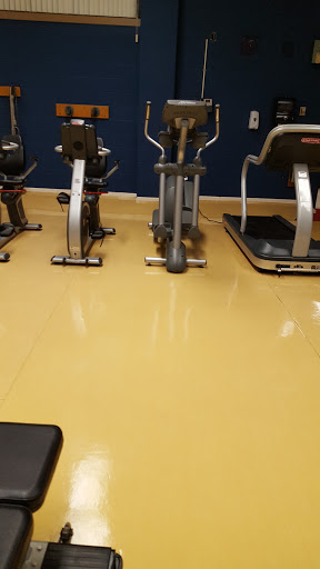 A view of exercise equipment in a gym setting.