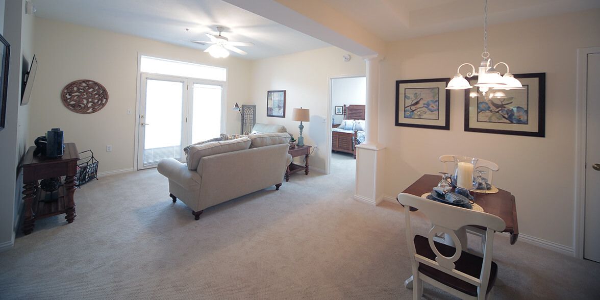 A bright living room with modern furniture and artwork.