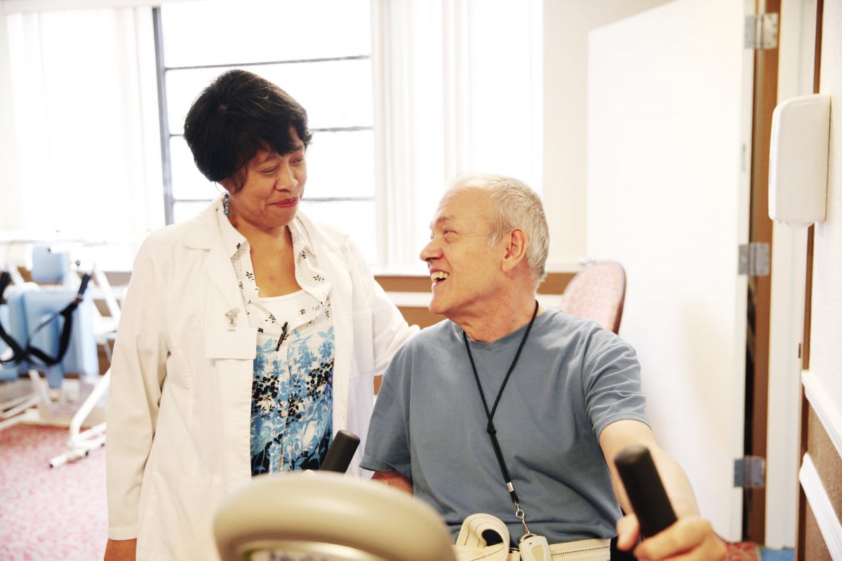 A doctor interacts with a patient during a medical consultation.