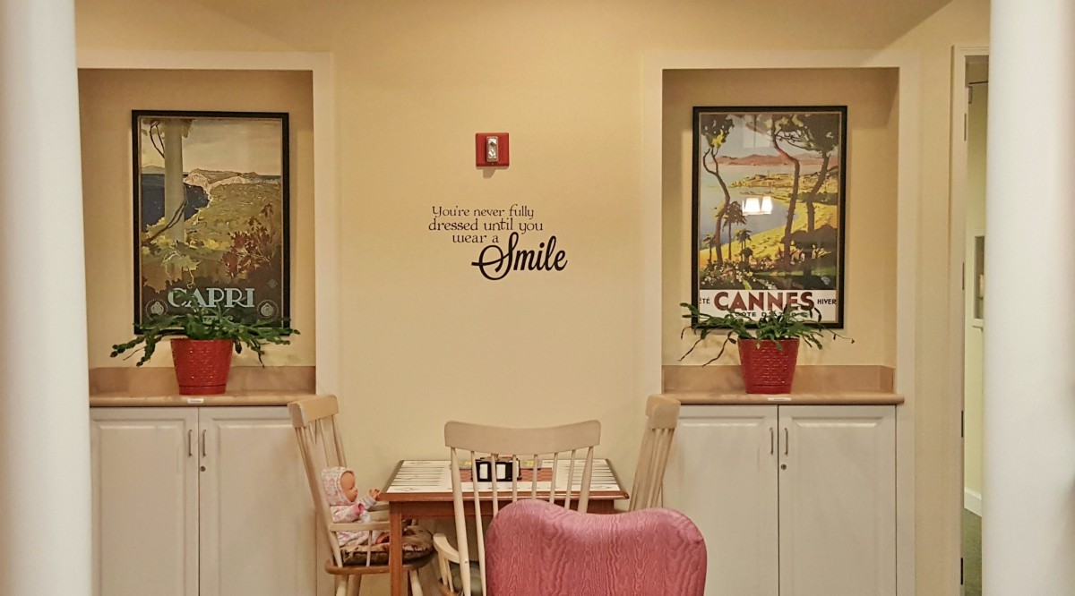 A cozy dining area with inspirational wall art and decorative posters.