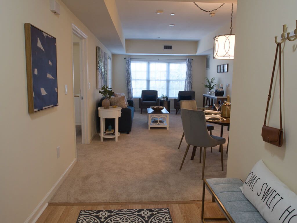 A modern open-plan living and dining space featuring stylish furniture and contemporary decor.