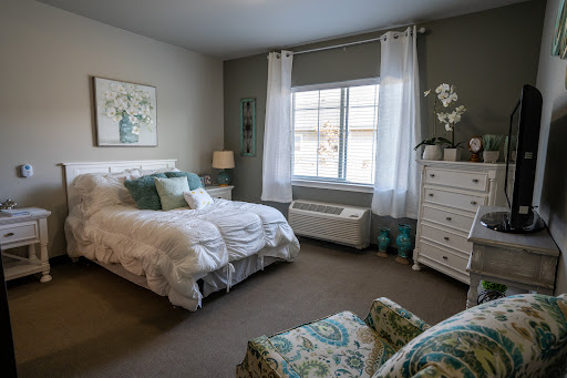 A serene and inviting bedroom featuring soft colors and elegant decor.