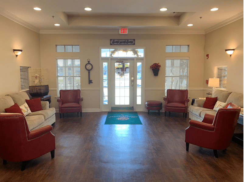 A cozy lobby with comfortable seating and decorative elements.