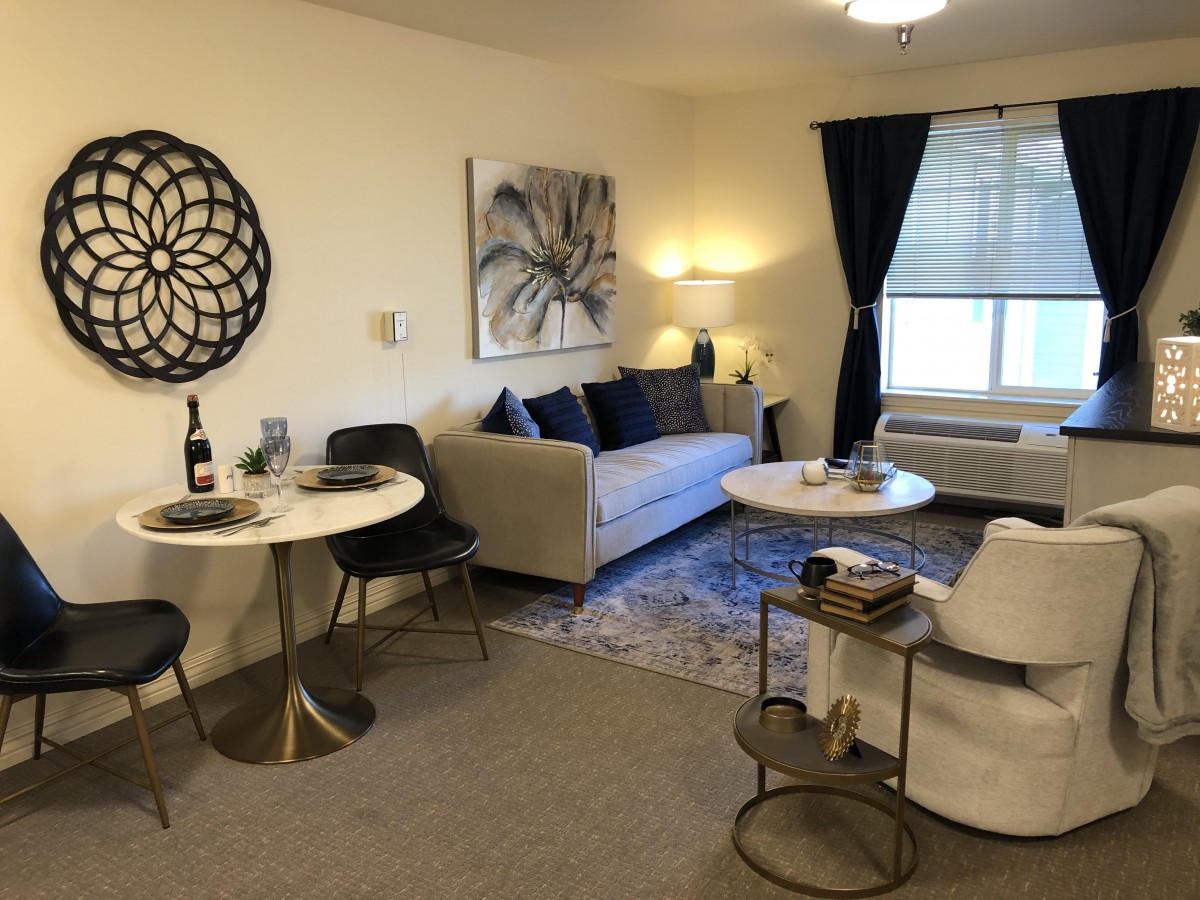 A cozy living room with modern decor and comfortable seating.