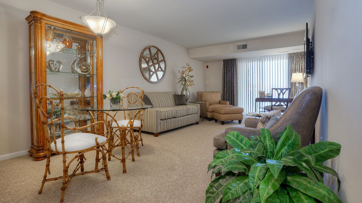 A modern living room with comfortable seating and elegant decor.