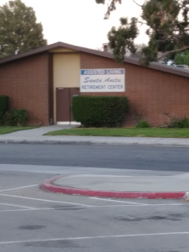 A view of a school building with a sign displaying its name.
