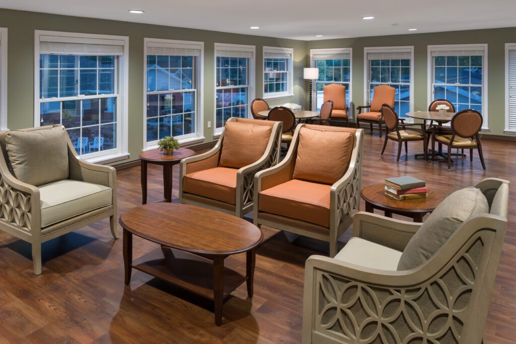 A cozy living room with comfortable seating and large windows.