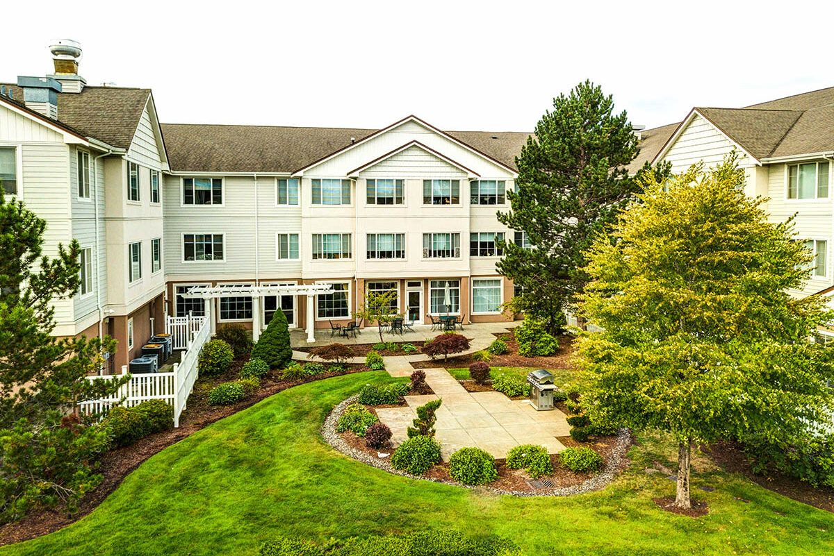 A well-maintained residential building with landscaped gardens.