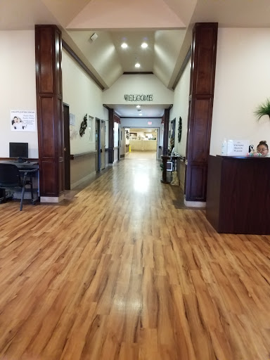 A spacious and well-lit hallway leading to a reception area.