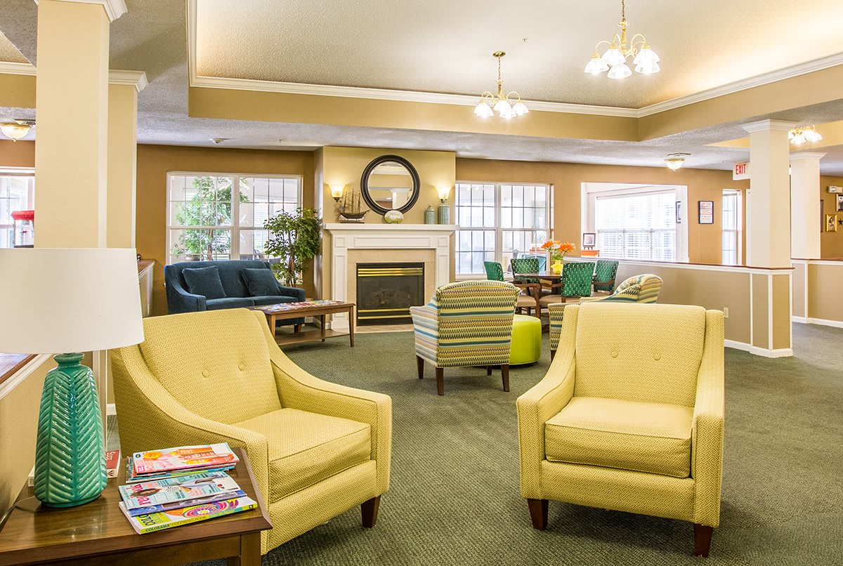 A cozy and elegantly designed living room with comfortable seating and a fireplace.