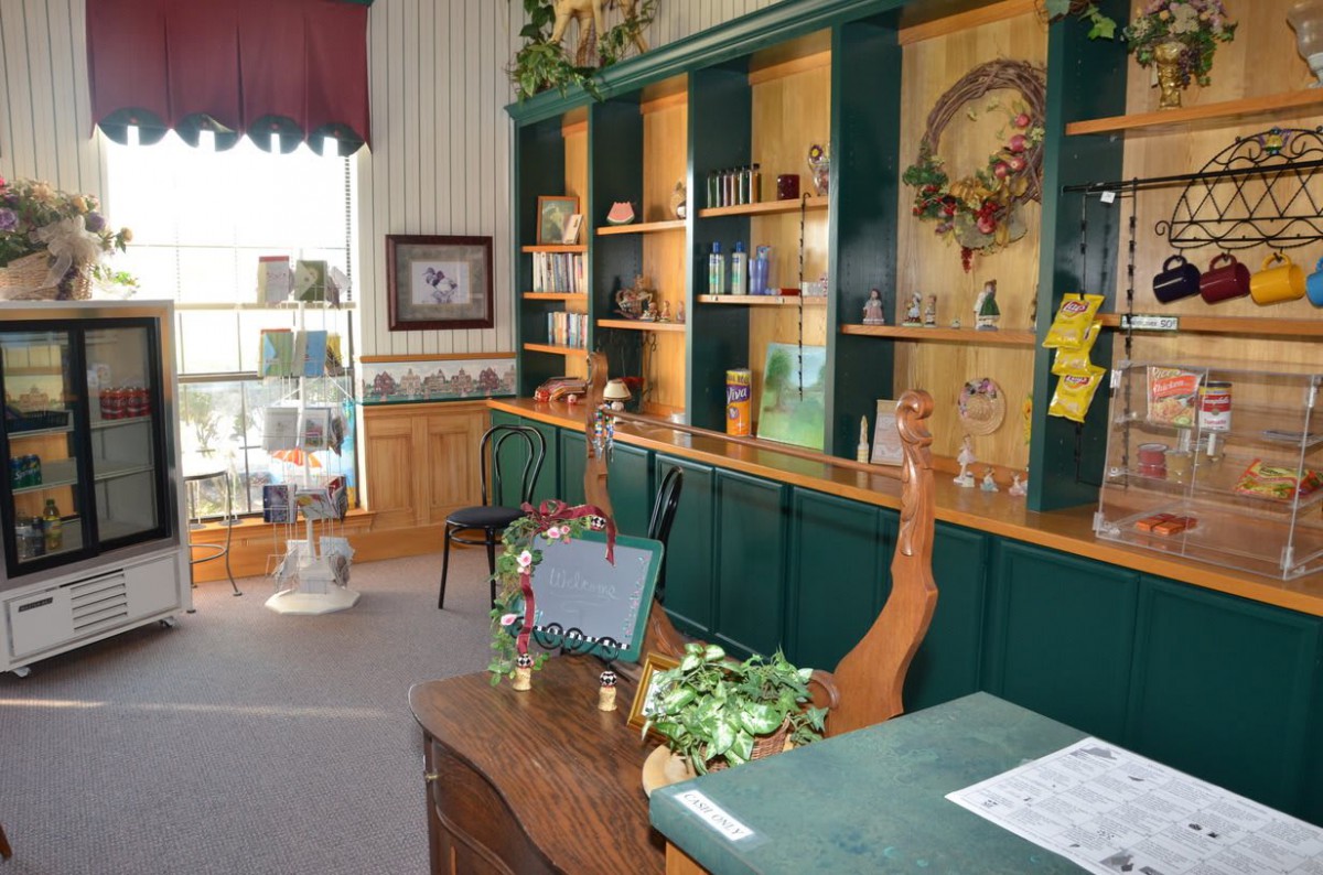 A cozy store interior with shelves displaying various products and decorations.