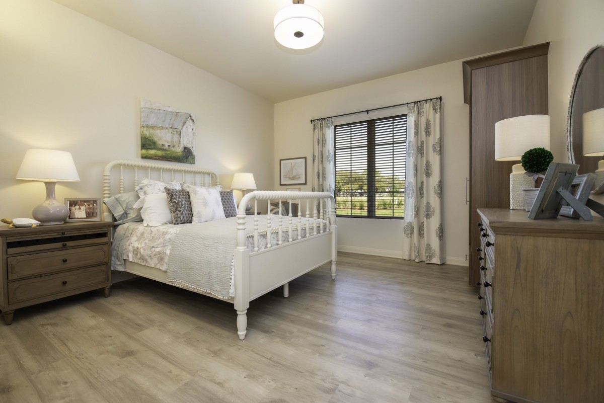 A cozy bedroom with a vintage-style bed and elegant decor.