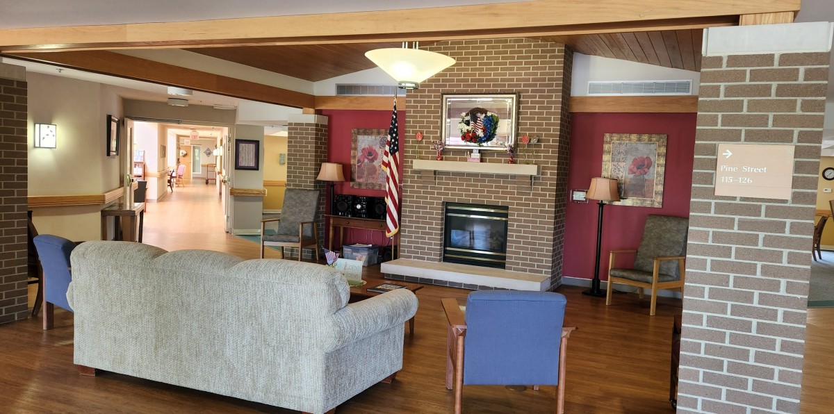 A cozy living room area with a fireplace and comfortable seating.