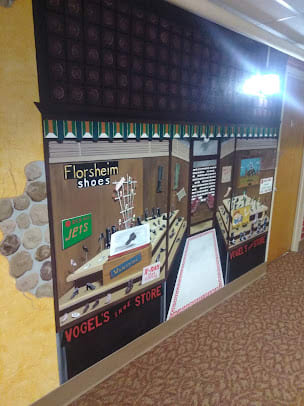 A mural depicting a floral shop with detailed storefront and interior design.